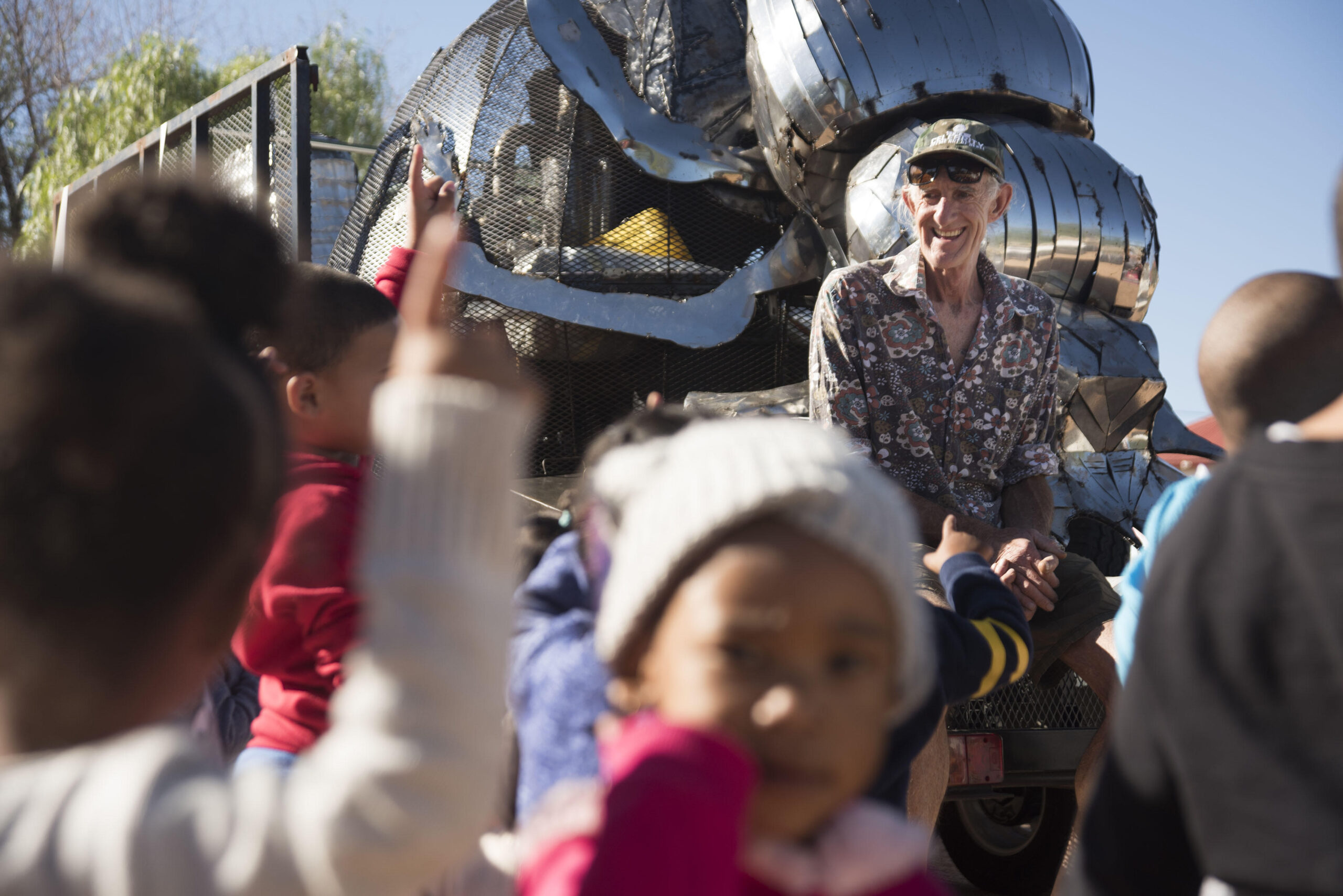 Pierre (Pops) Pretorius is called the Father of The Dung Beetle.  He talks here to young kids in Pofadder South Africa in the northern cape province. They came from the nearby day care to meet him and the Beetle during a recent outreach trip. The outreach in April 2019 for the Dung Beetle Project in the Northern Cape of South Africa at highschools in both Pofadder and SpringBok.